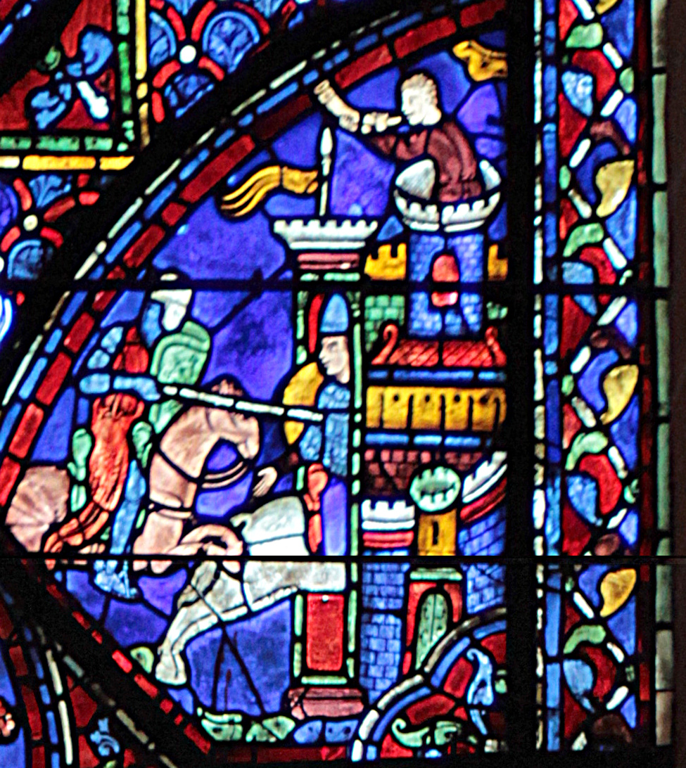Figura 1 - Vetrata colorata con scene figurative.
